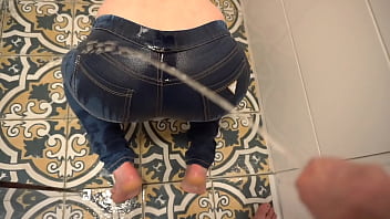 Amateur milf's homemade video features pissing in jeans and onto her partner's ass